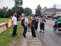Polsek binjai gelar operasi yustisi dan bagikan masker gratis