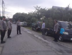 Petugas Polsek Sei Bingai lakukan program Oprasi Yustisi pencegahan virus corona serta bagi masker secara gratis kepada masyarakat